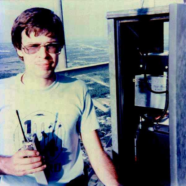 Chuck Adams N5UN in Quarter Gigger shirt at Cedar Hill cabinet, December 1981