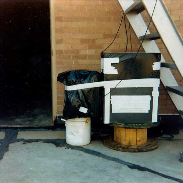 WB5SUF repeater with trash bag and duct tape weatherproofing on the TWU roof, October 1980